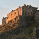 photography of brown castle on top of mountain during daytime